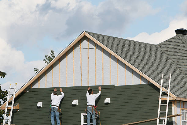 Professional Storm Damage Siding Repair technician working in Woodland, PA